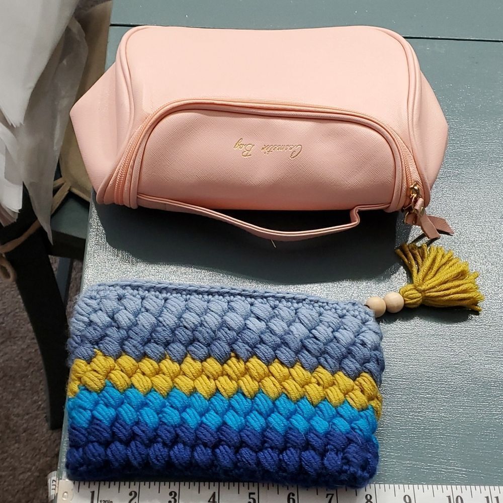Two cosmetic bags.‎ One in vintage and homemade. The other is pink and la…